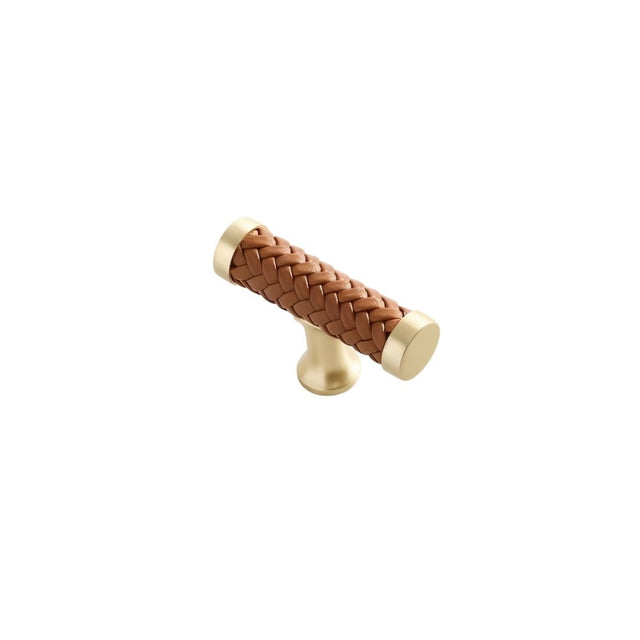 "Brown braided leather knob with gold accents, isolated on a white background."