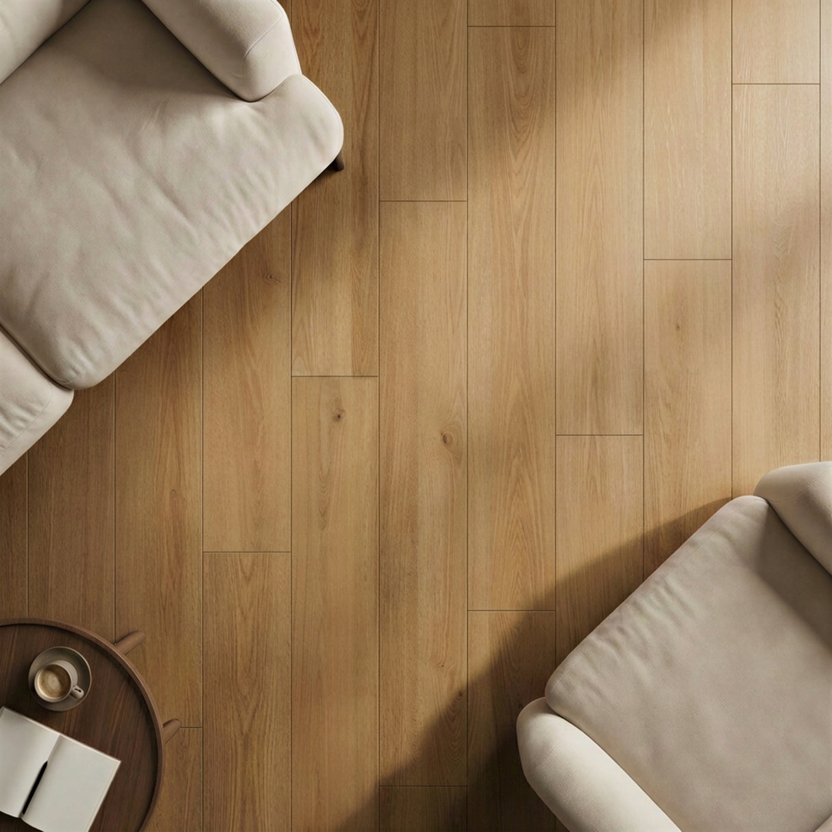 Dune Oak wood-look plank flooring in warm tan displayed in a bright living room with cream-upholstered seating.
