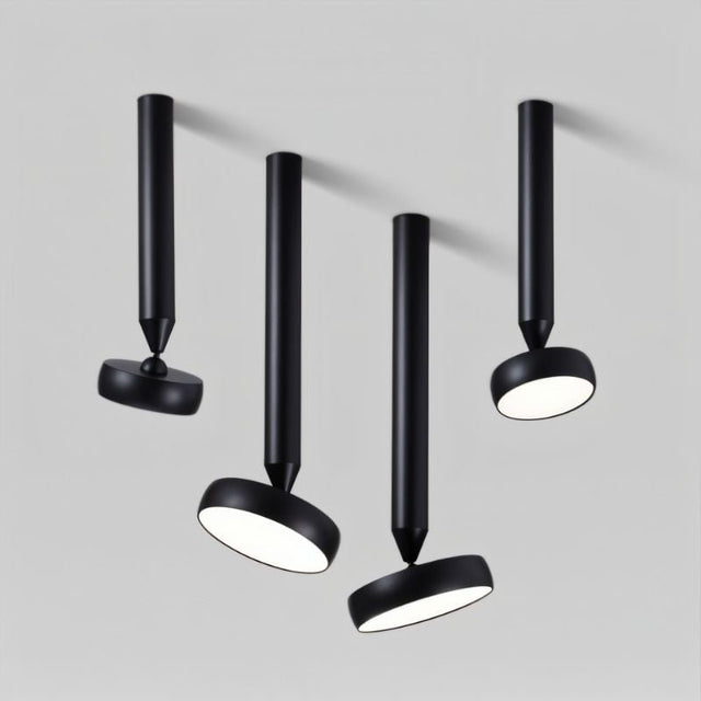 "Cluster of black ceiling-mounted lights with adjustable heads, cylindrical design, and durable aluminum material, industrial style."