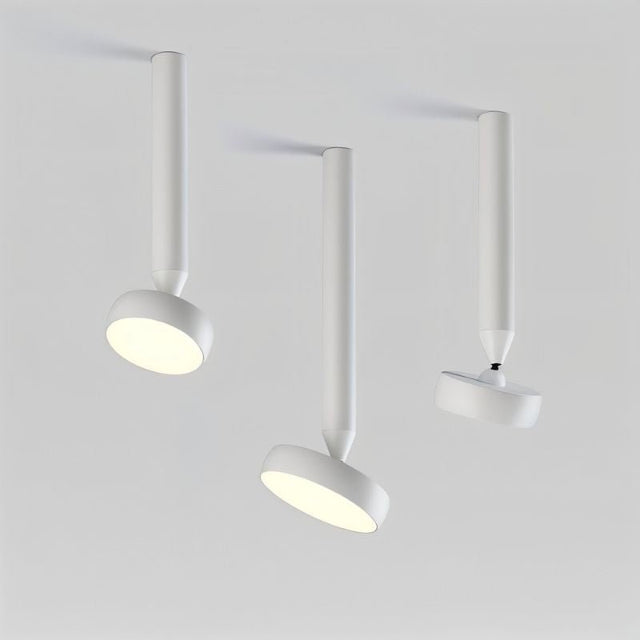 "Trio of white ceiling-mounted lights with cylindrical bodies, adjustable heads, and aluminum material, modern lighting setup."