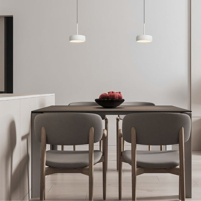"Pair of pendant lights over dining table, minimalist design, aluminum round shades, modern decor"