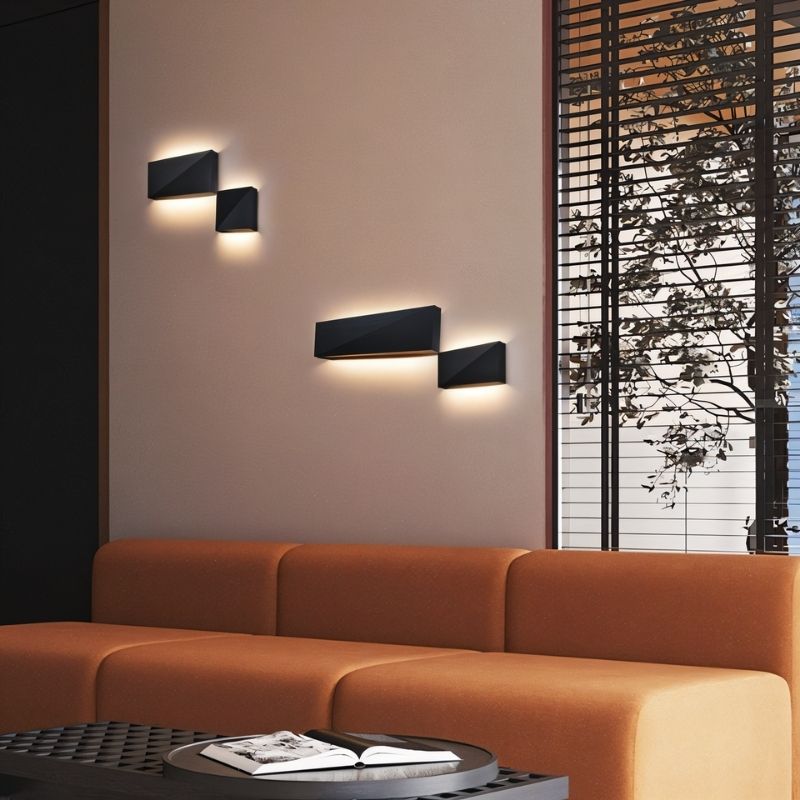 "modern wall lamp in living room, geometric angular design, aluminum material, matte black finish, ambient lighting"