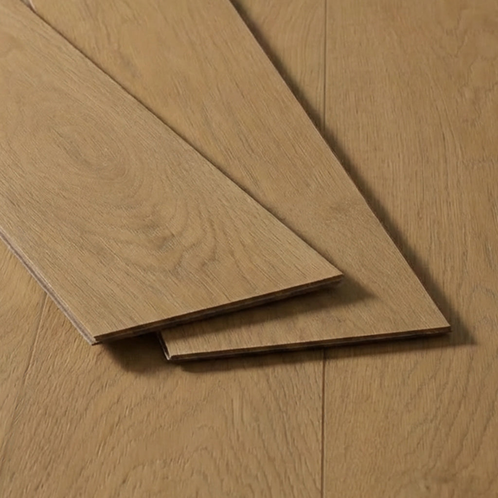 Three golden oak flooring planks on a light background, featuring a smooth finish and a natural wood texture.