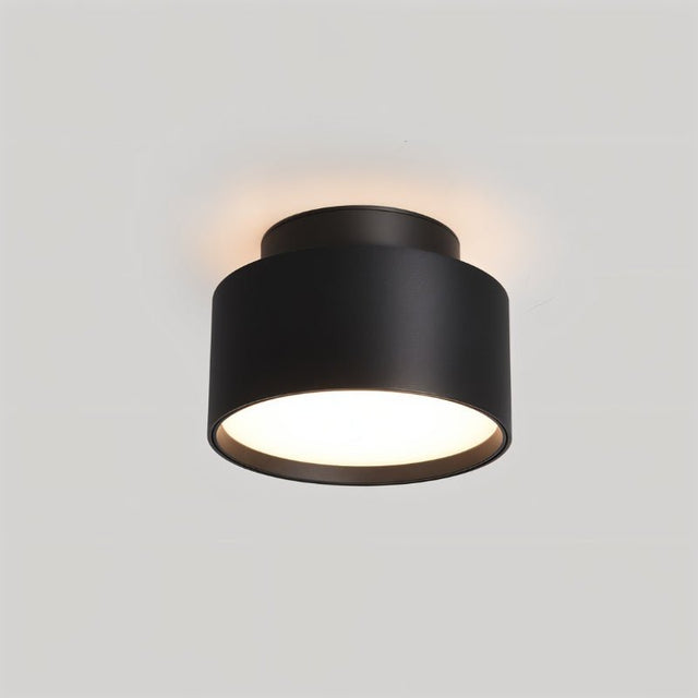 "Closeup view of a black ceiling light, aluminum drum-shaped design, soft ambient lighting."