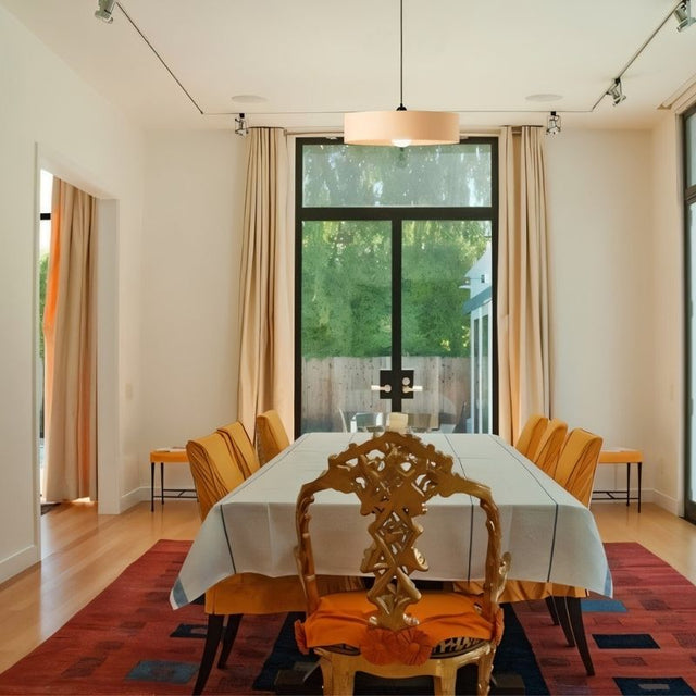 "Modern pendant light illuminating dining room, elegant table setting, natural light, contemporary decor"