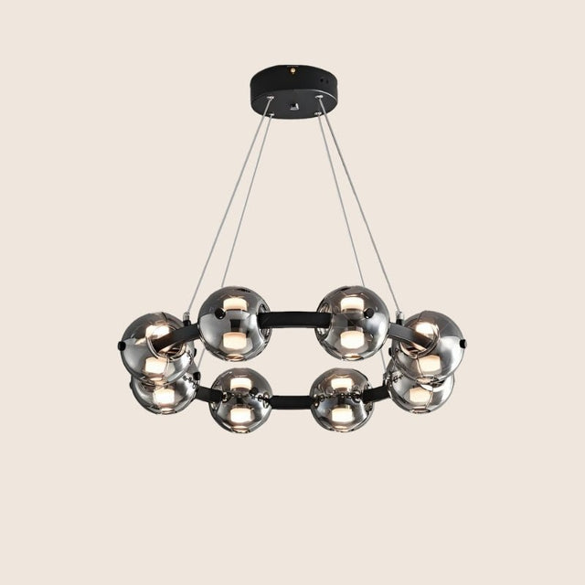 "Chandelier with smoked glass orbs and aluminum frame viewed from below."