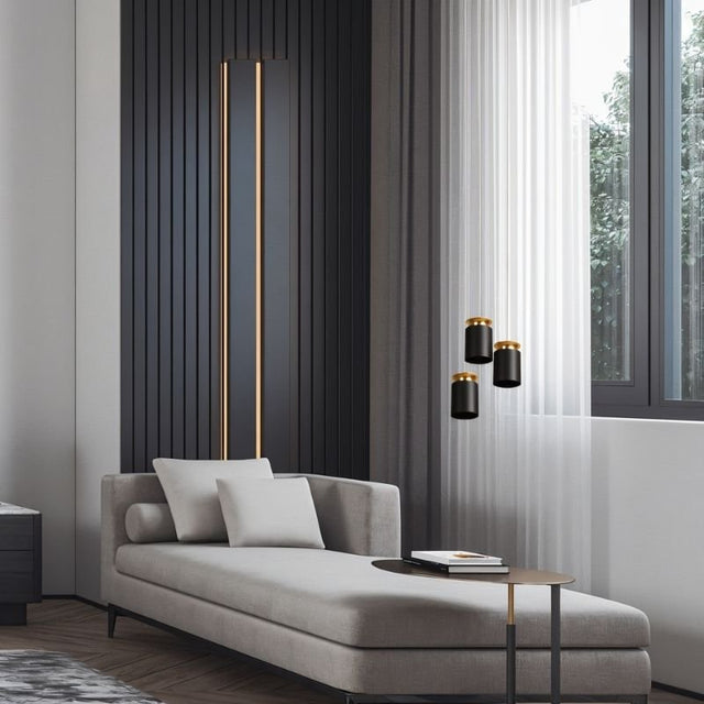 "Cozy living space with suspended aluminum pendant lights, black and gold finish, modern interior lighting"
