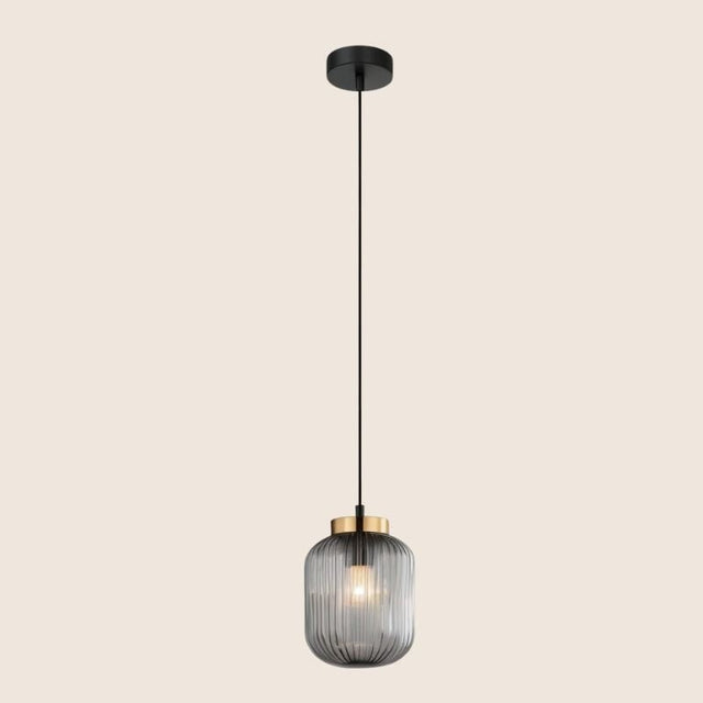 "Pendant light with black glass shade and gold accent, hanging with a sleek black cord in a minimalist design."