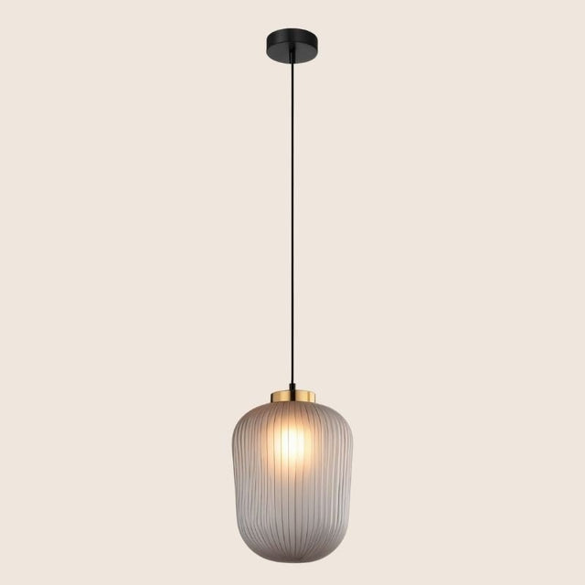 "Minimalist pendant light with clear glass shade and gold accent, ideal for stylish modern interiors."