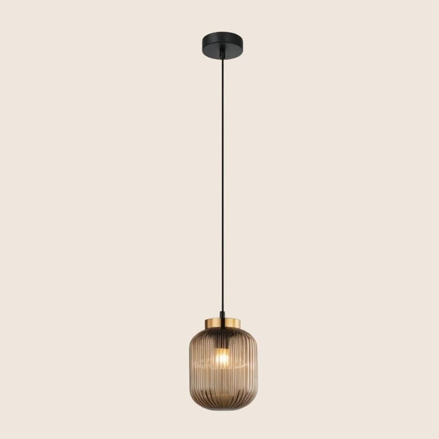 "Modern pendant light featuring a gold glass shade and black fixture, ideal for contemporary home décor."