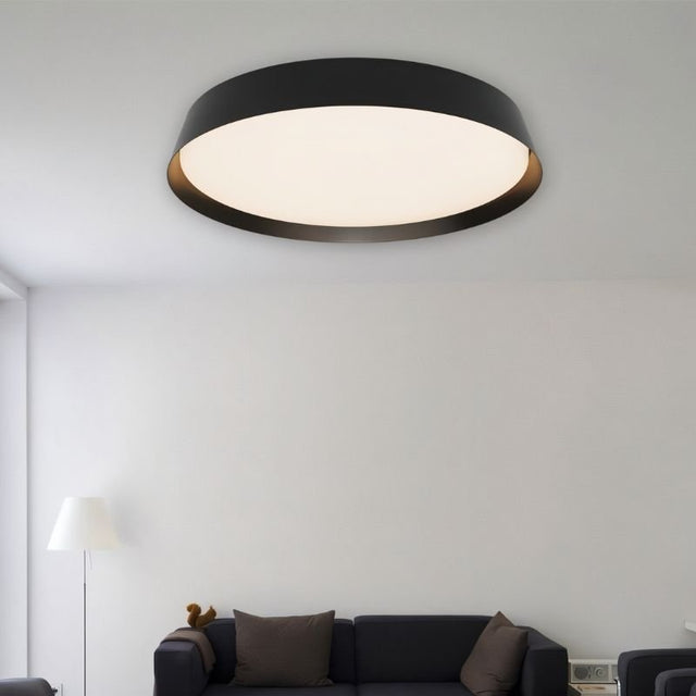 Large Zena Ceiling Lamp in black installed in a modern living room, providing soft, even illumination with a sleek flush-mount design.
