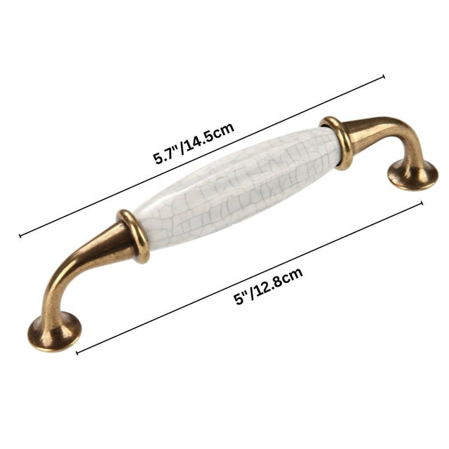 "Dimensions of a ceramic pull bar handle with a crackled glaze and antique brass supports, shown with measurements in inches and centimeters."