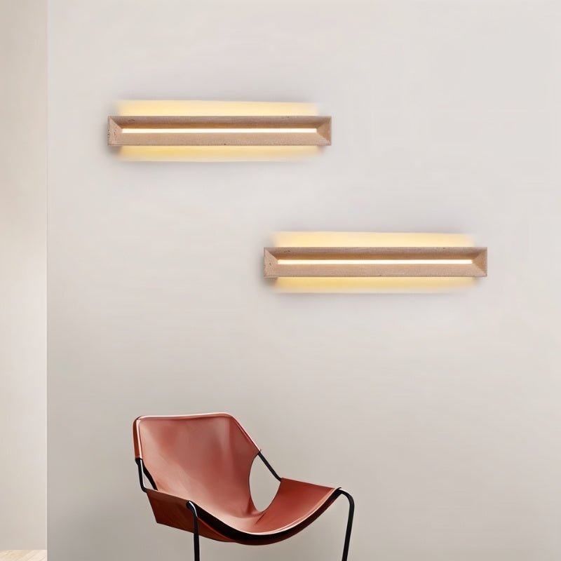 "Travertine wall lamps installed horizontally, offering warm lighting that enhances modern interiors like living rooms and hallways."