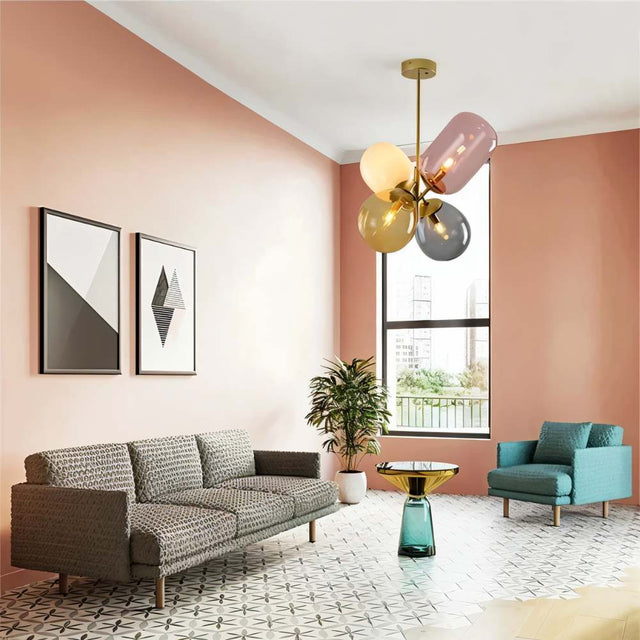 "Modern pendant light with clustered asymmetrical glass shades in a pink-themed living room."