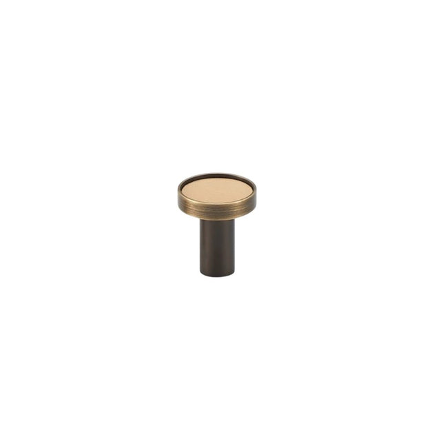 "Leather and brass knob with stitching detail, isolated on a white background."