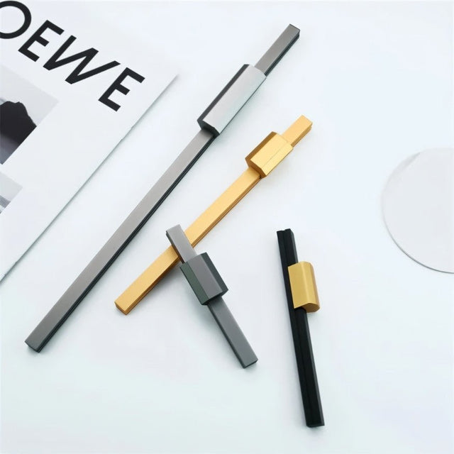 "Assorted colorful aluminum pull bars for modern cabinetry, including black, gold, and silver finishes."