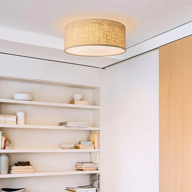 "Minimalist fabric ceiling light fixture in a contemporary living room setting."