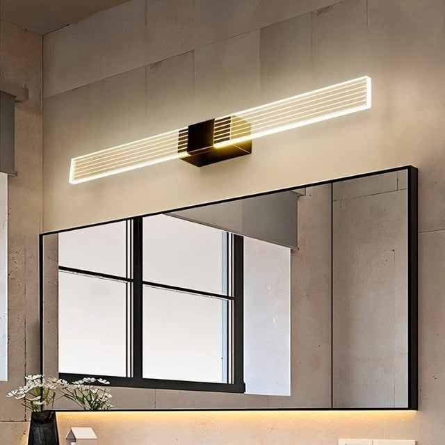 "Modern bathroom vanity light with a sleek design mounted above a large mirror."