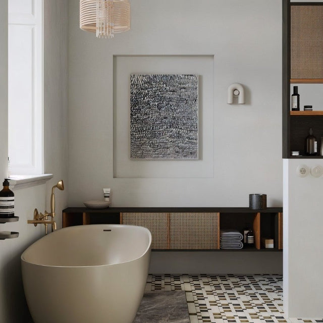 "A gray, contemporary wall lamp with a looped design, mounted on a white wall in a modern bathroom setting."