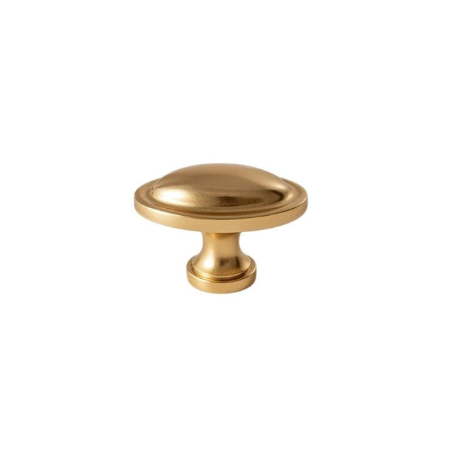 "Vintage solid brass oval knob, adding a refined touch to classic cabinetry."