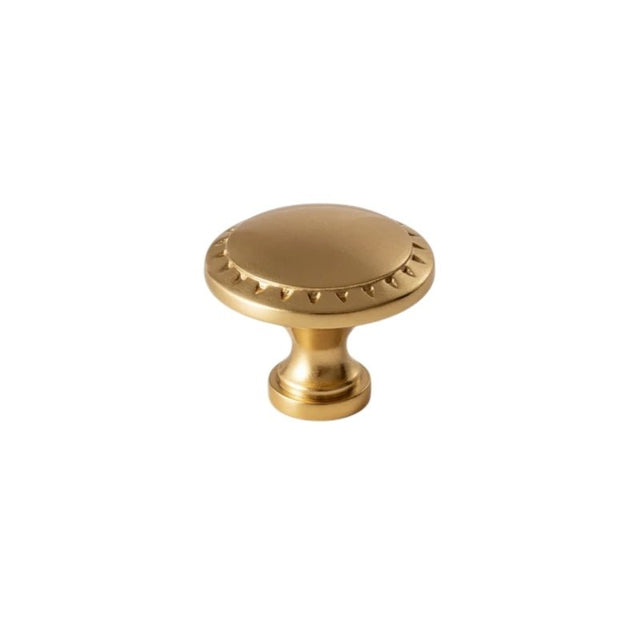 "Vintage solid brass knob with intricate Grecian-inspired patterns, adding a touch of classic elegance to cabinetry."