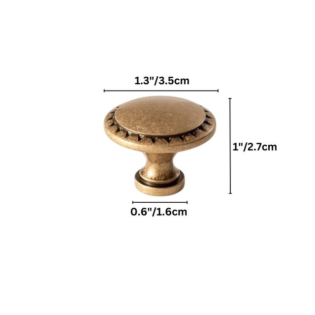 "Vintage solid brass knob with intricate detailing, adding a classic touch to cabinetry."