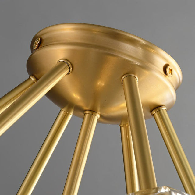 "Close-up of the brass finish and structural details of a modern ceiling light."