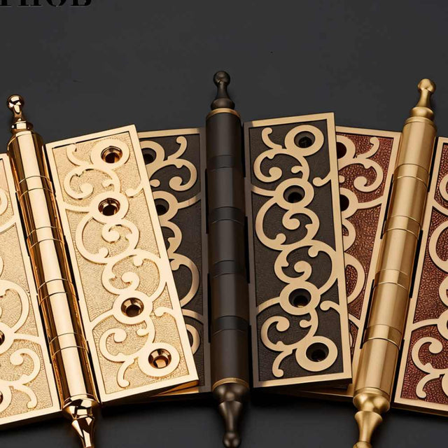 "Ornate brass door hinges with scrollwork design, featuring a mix of polished and textured finishes."