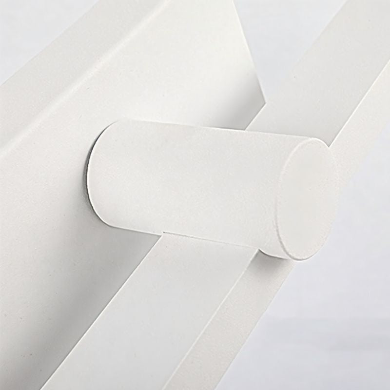 "A close-up view of the Dralis LED vanity light, showcasing its minimalist design and wall-mounted structure."