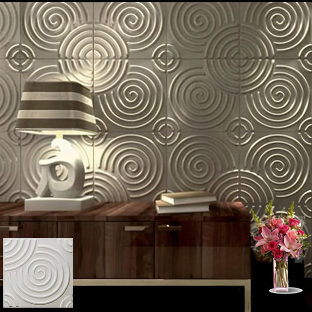 Egena Wall Panel with spiral 3D design in metallic finish, enhancing a modern living room with PVC wall panel decor.