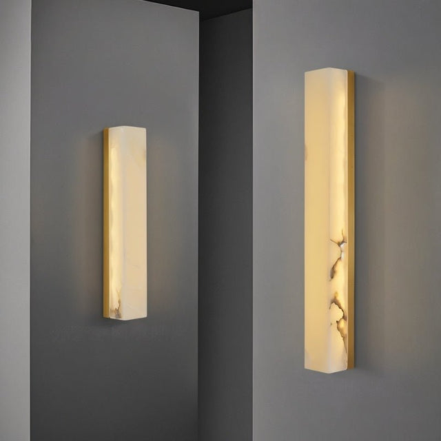 "Two sizes of the Emerson brass wall lamp, showcasing the design's versatility for different spaces and lighting needs."