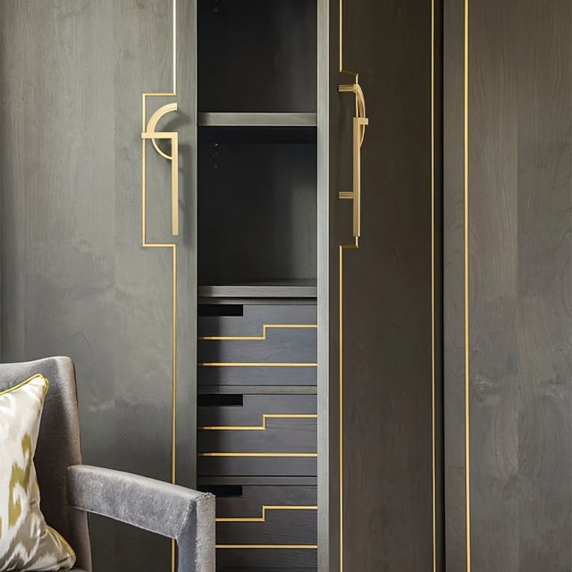"geometric brass pull bar installed on modern cabinet with minimalist design"