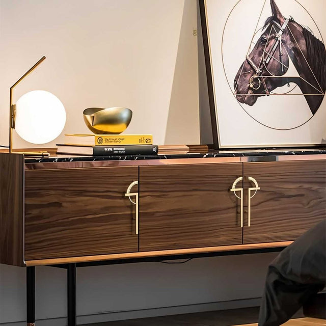 "gold pull bars on modern furniture with geometric design"