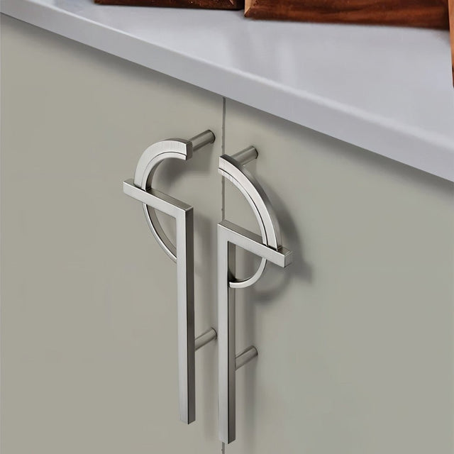 "modern silver pull bars installed on elegant cabinet doors"