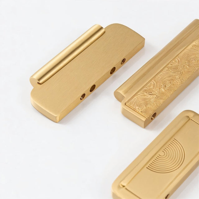 "Set of gold textured Erdas pull bar handles on a white background."