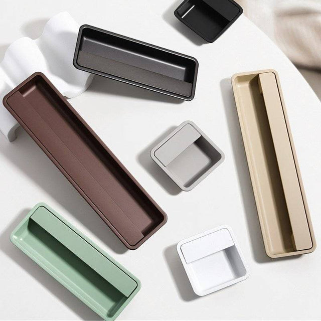 "Recessed drawer pulls in various colors, made of aluminum alloy, showcasing a minimalist design."