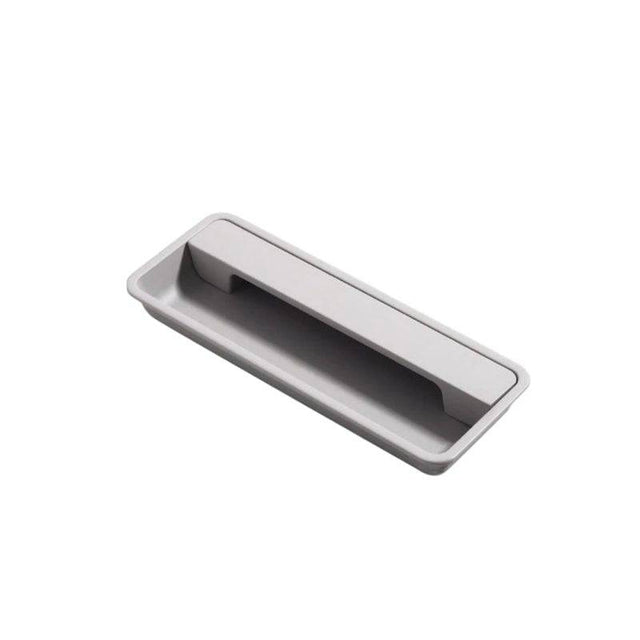 "Gray recessed rectangular drawer pull made of aluminum, sleek minimalist design."