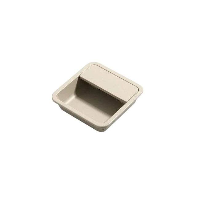 "Beige aluminum recessed drawer pull with a minimalist design, isolated on a white background."