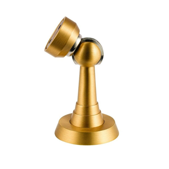 "Brushed gold magnetic door stop with a tilted head, isolated on a white background."