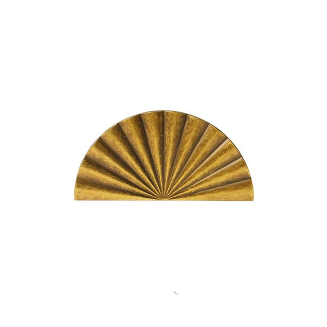 "A vintage brass fan-shaped drawer pull made of durable metal with a ridged, pleated surface and intricate grooves, in a half-moon Art Deco-inspired design, isolated on a white background."
