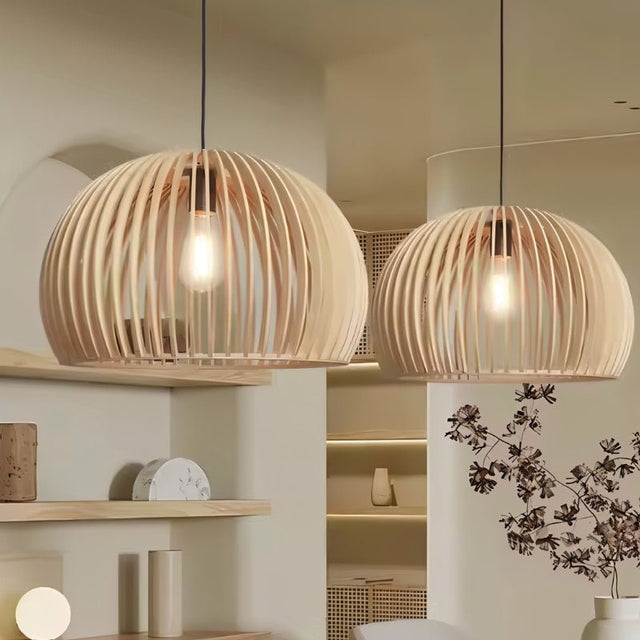 "Two wooden pendant lights with slatted dome design, hanging side by side, creating a stylish and inviting atmosphere with natural wood material."