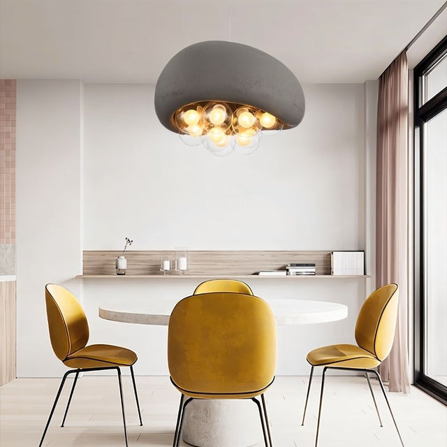 "modern dining room with resin dome pendant light, glowing globes, minimalist decor, and yellow accent chairs"