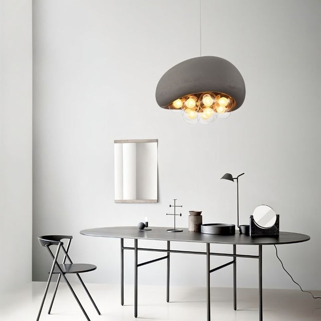 "modern dining room with resin dome pendant light, illuminated globes, and minimalistic decor"