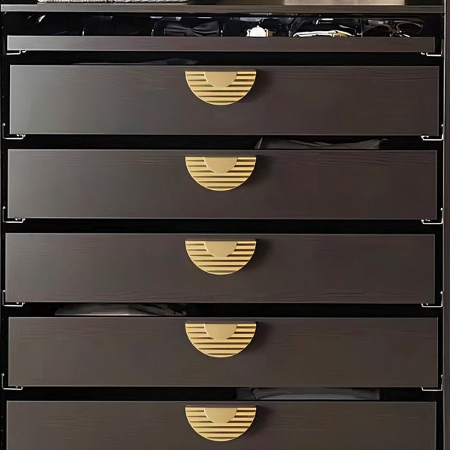 "Semi-circular drawer pulls with ridged texture, crafted from zinc alloy, mounted on dark gray contemporary drawers."
