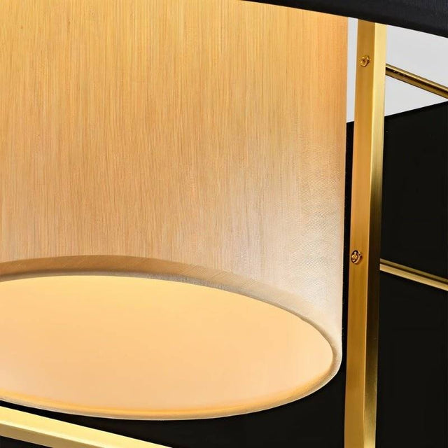 "Close-up of the fabric shade and diffuser of a pendant light."