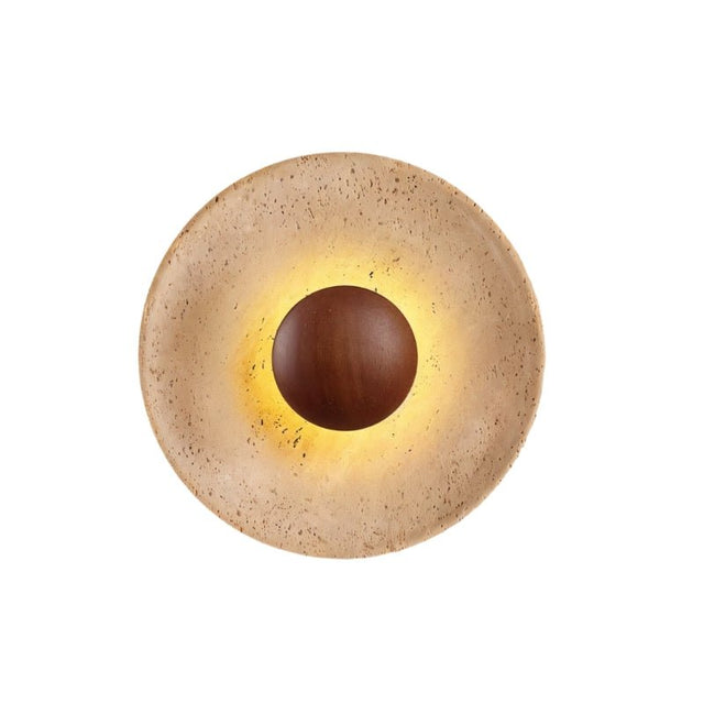 "A modern, circular wall lamp made of yellow travertine with a walnut wood center, shown directly from the front and isolated on a white background."