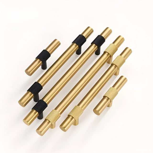 "Set of modern brass knobs and pull bar handles with brushed gold and black knurled finishes."