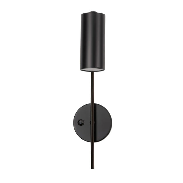 "A minimalist industrial black bedside reading lamp with a cylindrical shade and adjustable arm, featuring a visible on/off switch on the wall mount, isolated on a white background."