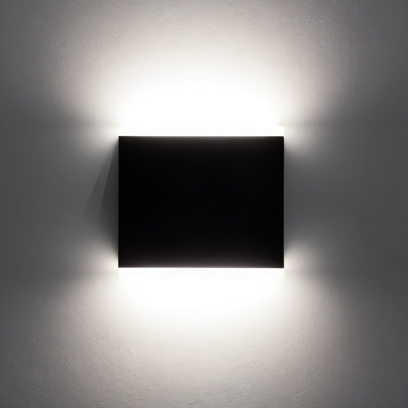 "Contemporary Helor wall lamp providing soft, balanced illumination, crafted with durable aluminium and polycarbonate diffusers for modern hallways, patios, and balconies."