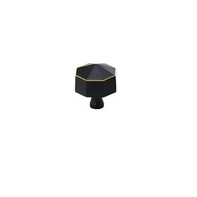 "Angled view of a black brass hexagonal knob, isolated on a white background."